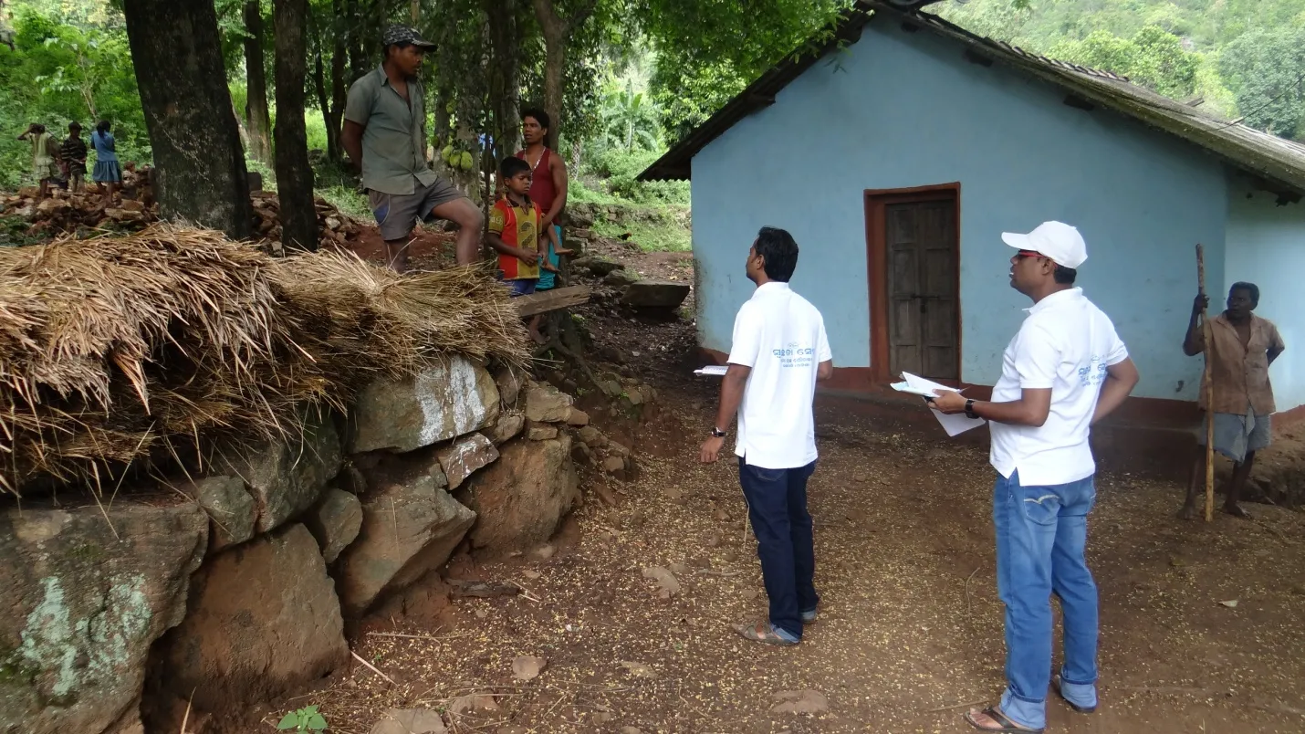 Prakash Kumar Sahoo with Junior engineer of Nuagada block inspecting toilet construction work during a field visit to Kudinda village 
