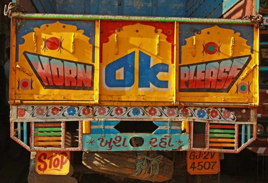 Gujarati text roughly reads 