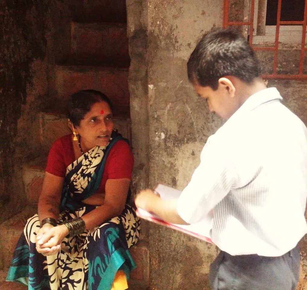 Kid interviewing a resident for his SLP project