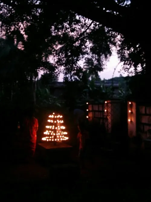 A tiny village temple lit up for the evening. 
