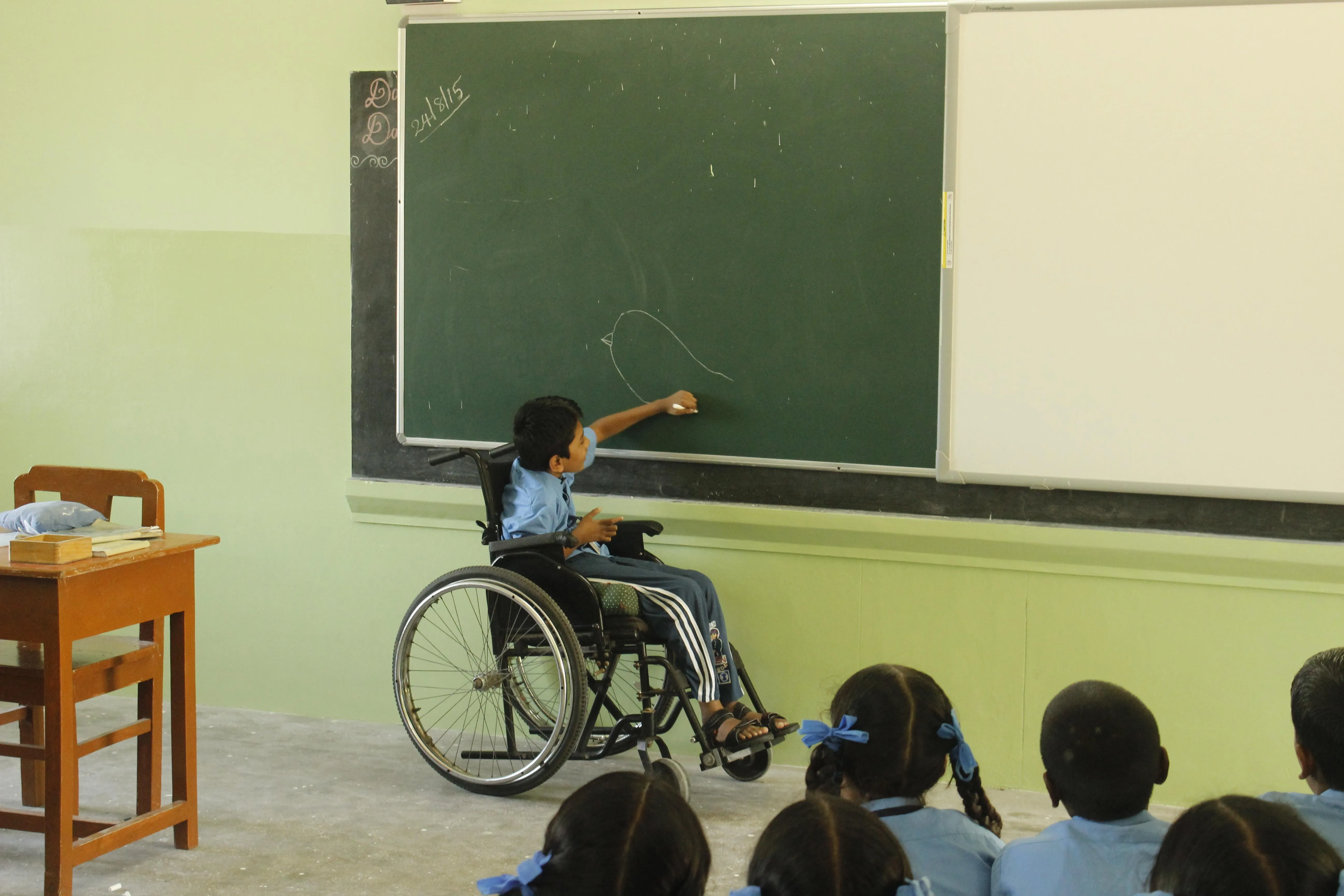 Jayakumar, who is paralysed neck down and has marginal use of his hands, uses his training at the rehabilitation centre to full effect in school.