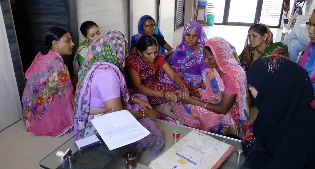 Women gift a widow colorful bangles, saree and bindi once the rituals for the deceased are over, as a first step against social stigmatization. (Photo by Coastal Salinity Prevention Cell)