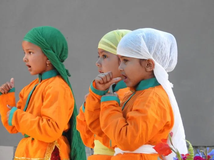 Students performing a Kumaoni Dance for a cultural performance. (Source; Chirag School)
