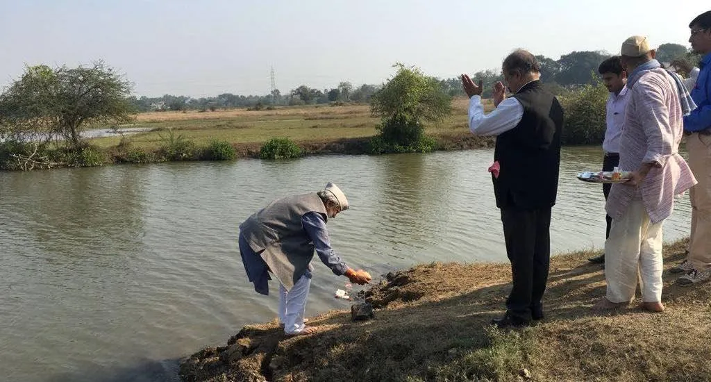 Villagers, led by water conservationist Rajendra Singh, performing puja at the lake, a community asset they have created. (Photo by Hiren Kumar Bose)