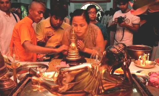 A monk points to a relic of Buddha inside a gold casket. For representational purposes only. 
