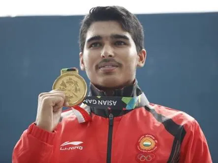 from humble beginnings: Saurabh Chaudhary standing tall with his shooting gold. (Source: Facebook)