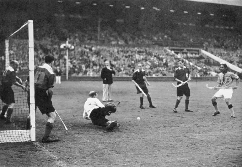 India scoring their third goal in the final. (Source: Wikimedia Commons)