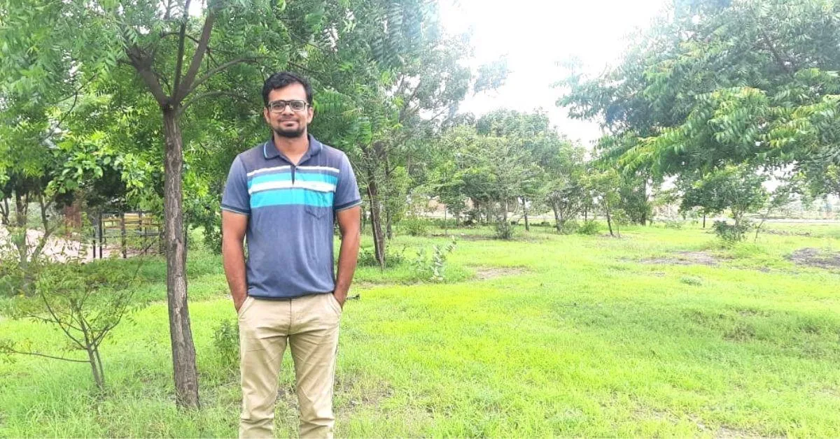 Bhaktaraj Garje with plantation at primary school in Kulalwadi, Sangli.