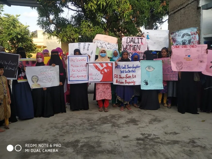 A group of muslim and dalit women out protesting on the streets. 