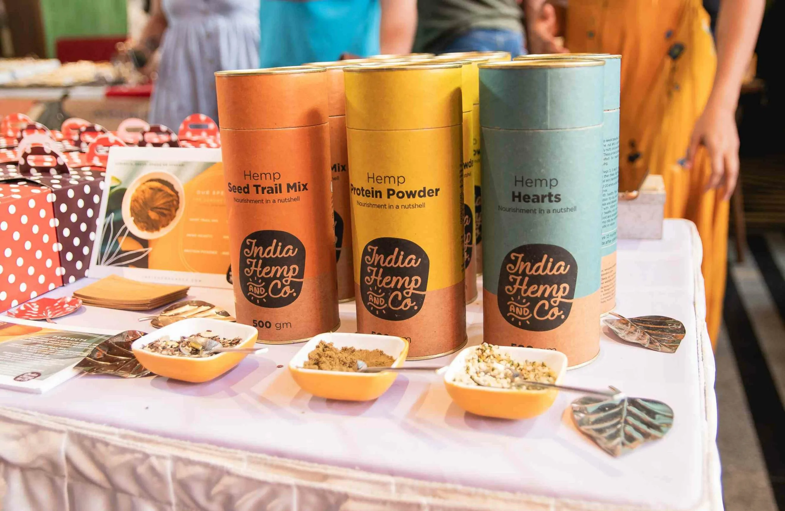 Product canisters by India Hemp & Co. at an exhibition. 