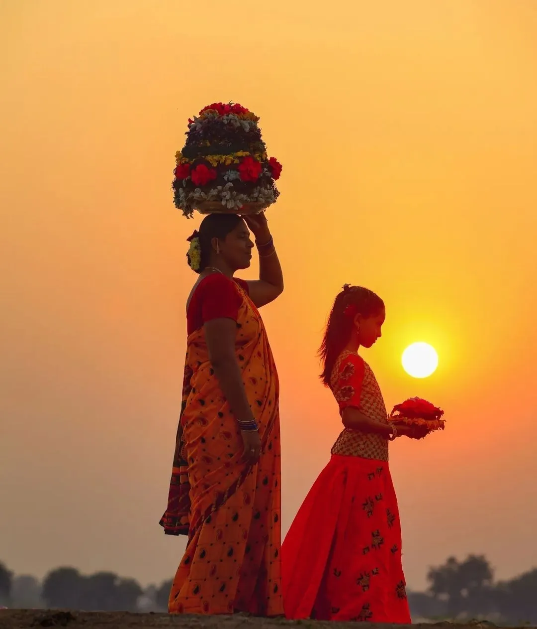 The ritual of the Bathukamma involves dancing around a stack of flowers and is celebrated with great pomp in Telangana.