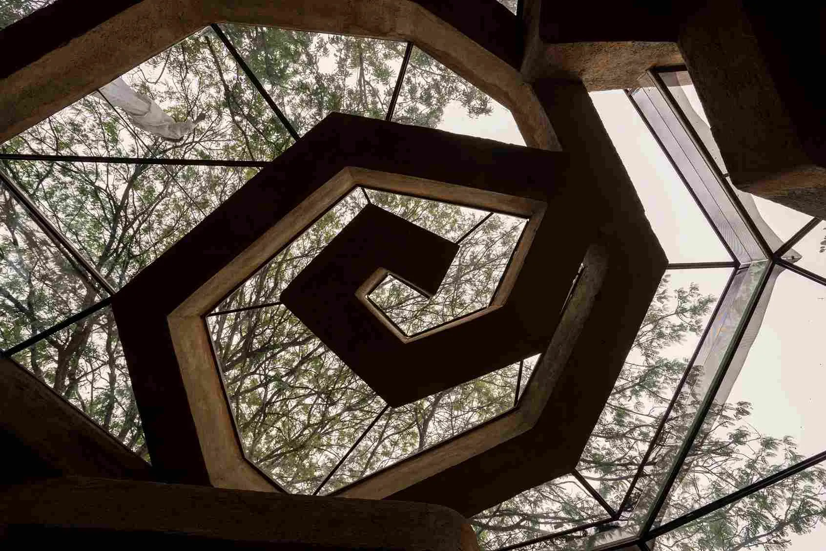 The spiral ceiling at Chuzhi is made with plastic bottle beams stacked with earth