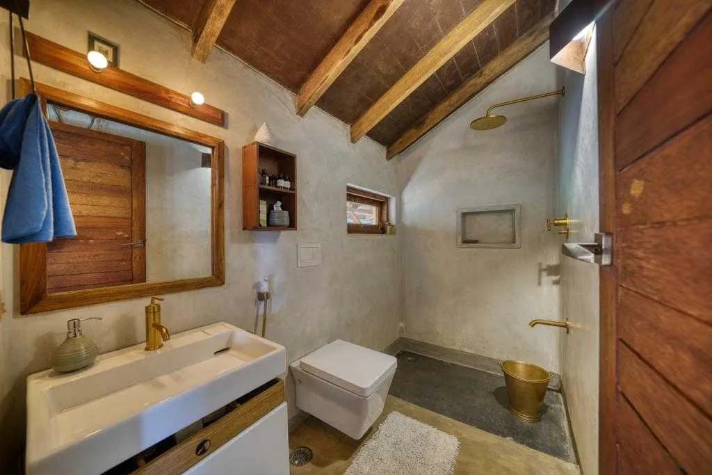 The sustainable home's washrooms are made from laterite stone and recycled wood
