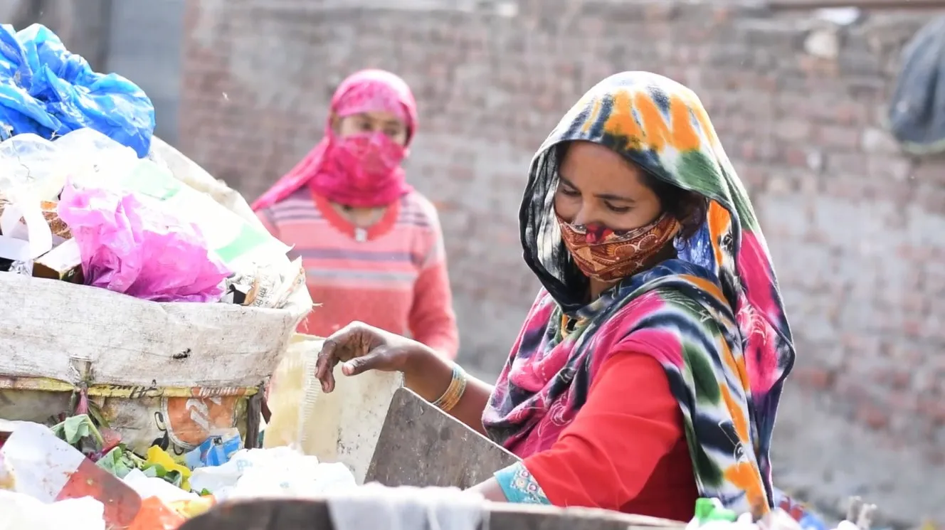Trash being separated in a dumpyard