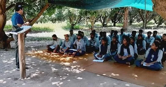 Colonel Mohanty briefing interns at his farm.