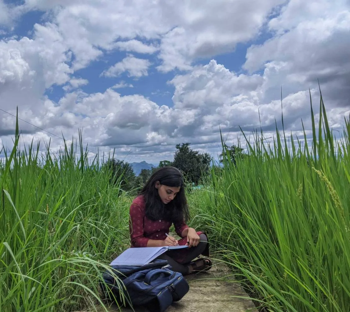 Babli is engrossed in journaling her thoughts on a beautiful sunny day in a village in Himachal.<br />
