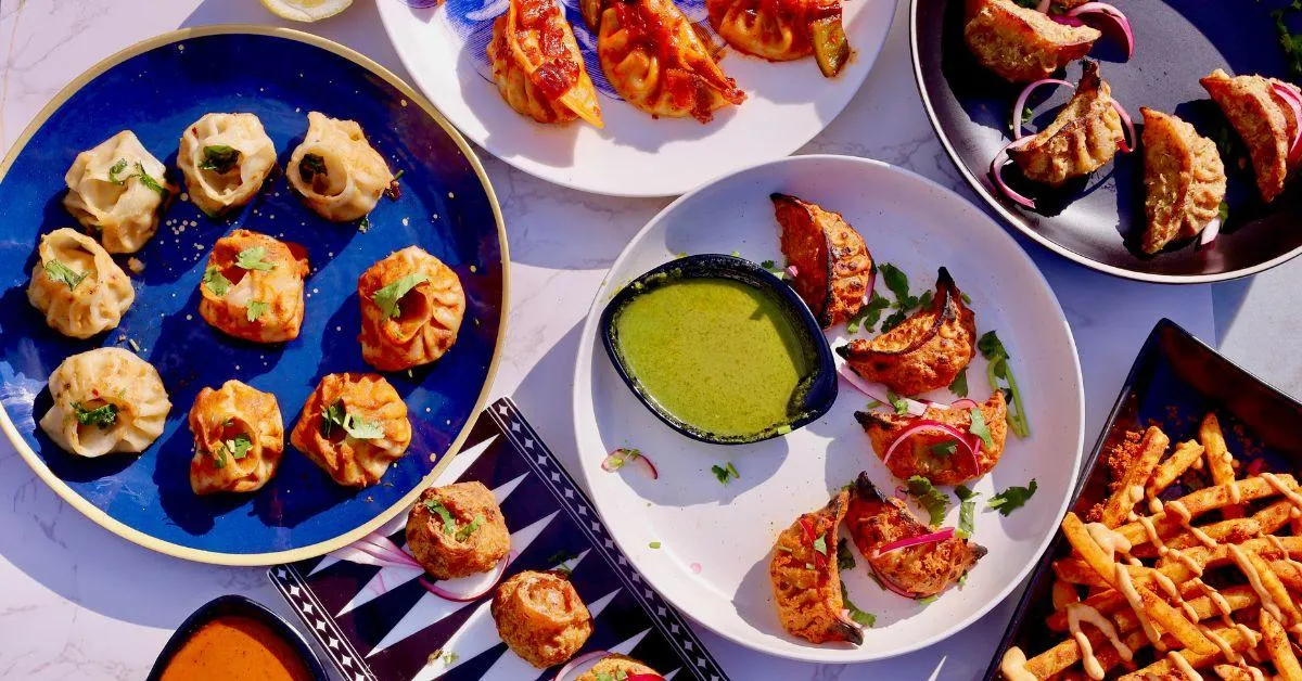 The momo varieties include butter garlic momos, tandoori momos,