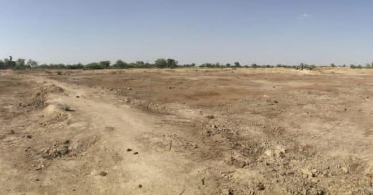 The dry reservoir that was filled with silt was unable to fill up with water during the monsoons