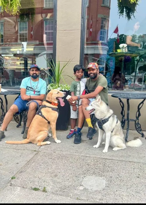 The couple with their son and two dogs