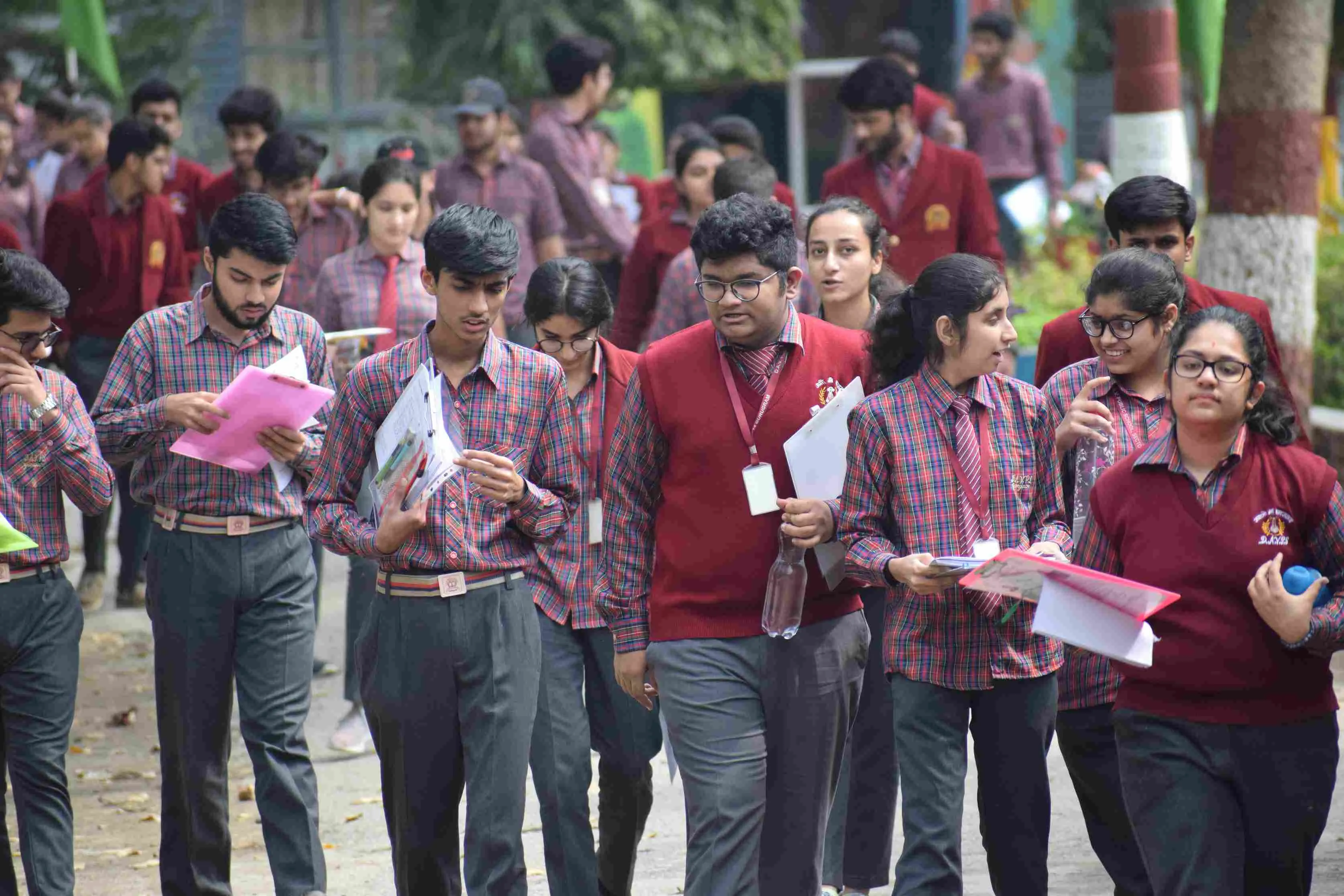 Some parents and teachers support the move for its flexibility and stress reduction, while others feel its success depends on proper implementation.