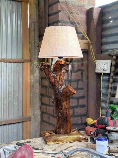 A rustic lamp crafted from reclaimed wood brings warmth and sustainability to any space.