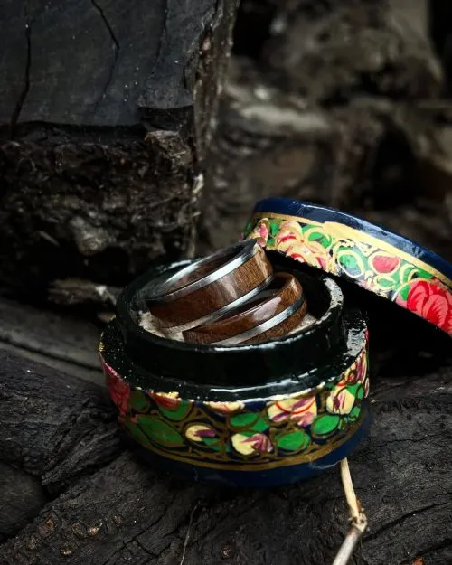 Naturally crafted, hand-carved walnut wood couple rings. Image source: Instagram