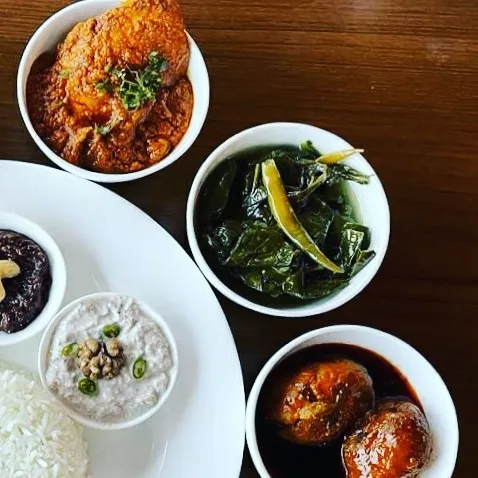 Crispy, spice-infused Dum Aloo, paired with flavourful Haakh (Kashmiri collard greens) and steaming hot rice.