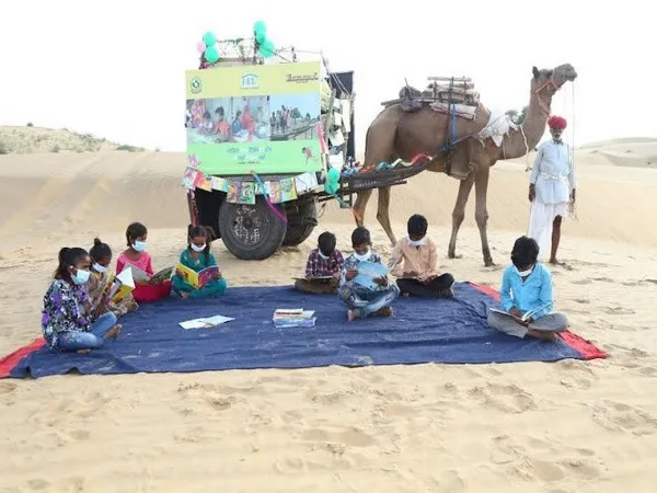 The unique camel cart library in Rajasthan is sweetly decorated with balloons.