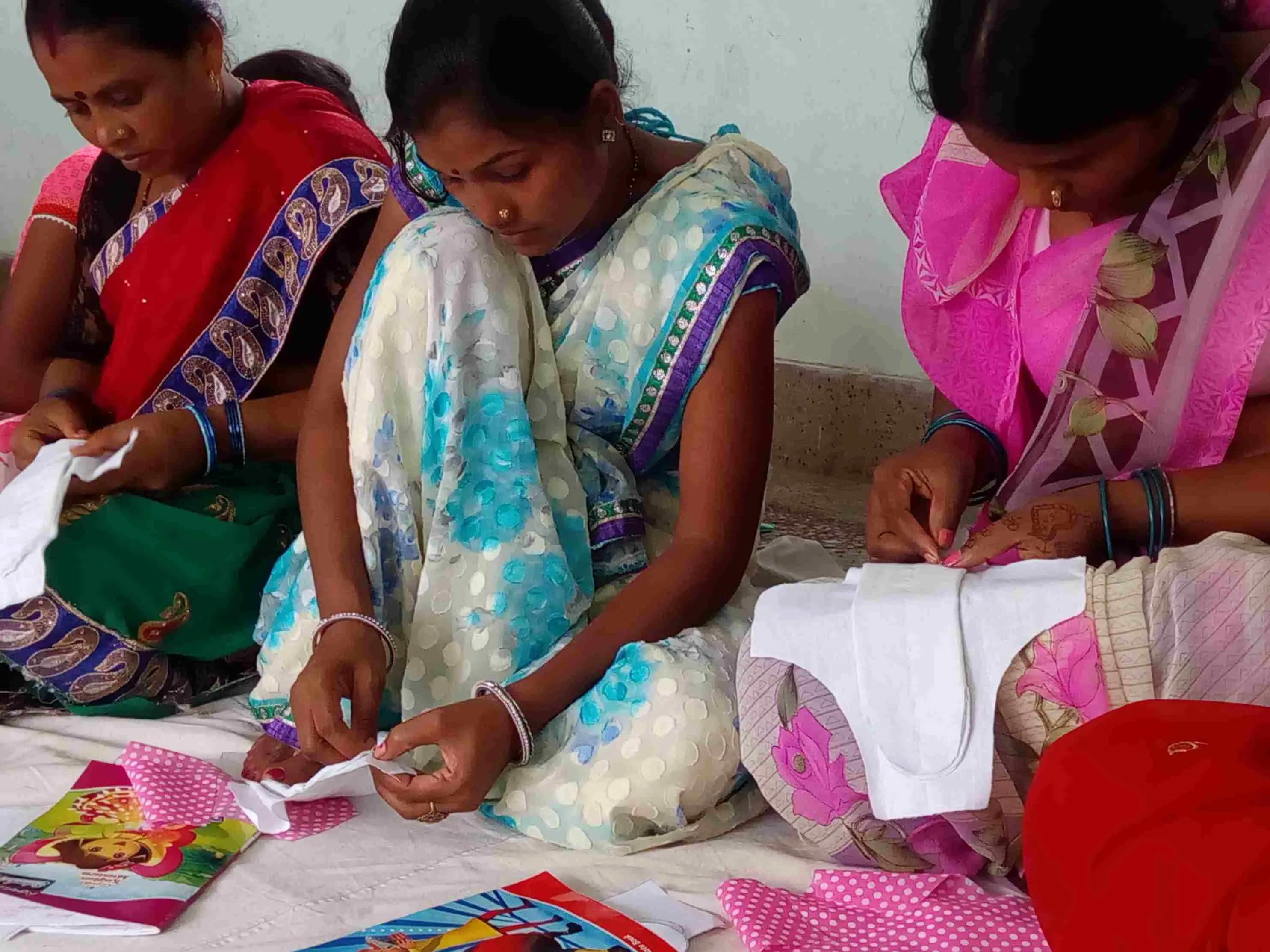 Rural women take charge of menstrual health by stitching reusable pads — a skill taught by Jatan to enable income generation and improve access to sustainable products.