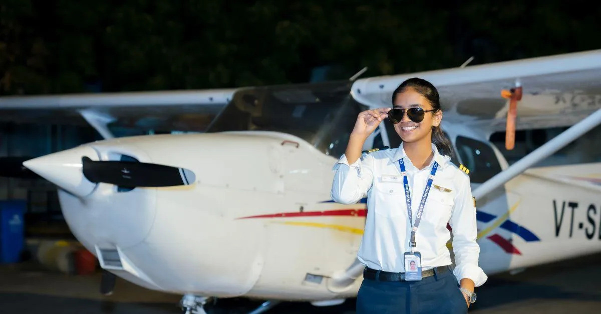 Samaira in front of a plane