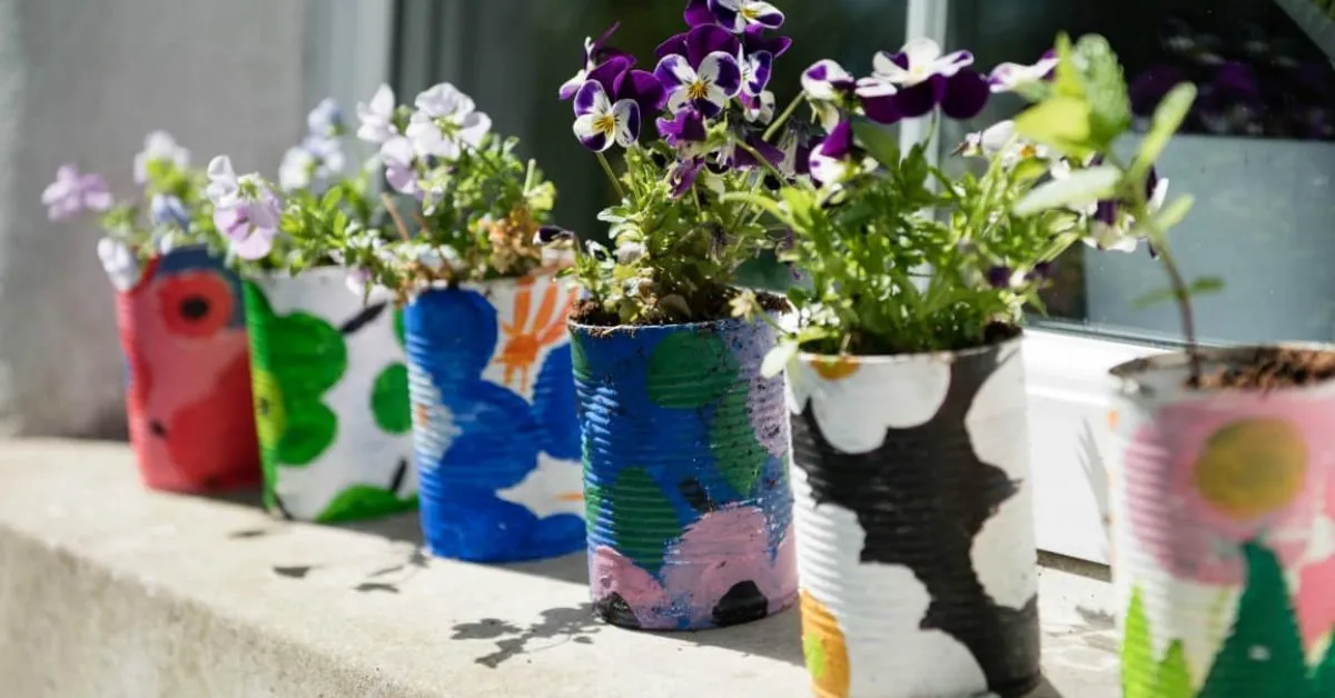 Ask your kids to implement their creativity on different tin cans and use them as planters; Picture source: Family Focus Blog