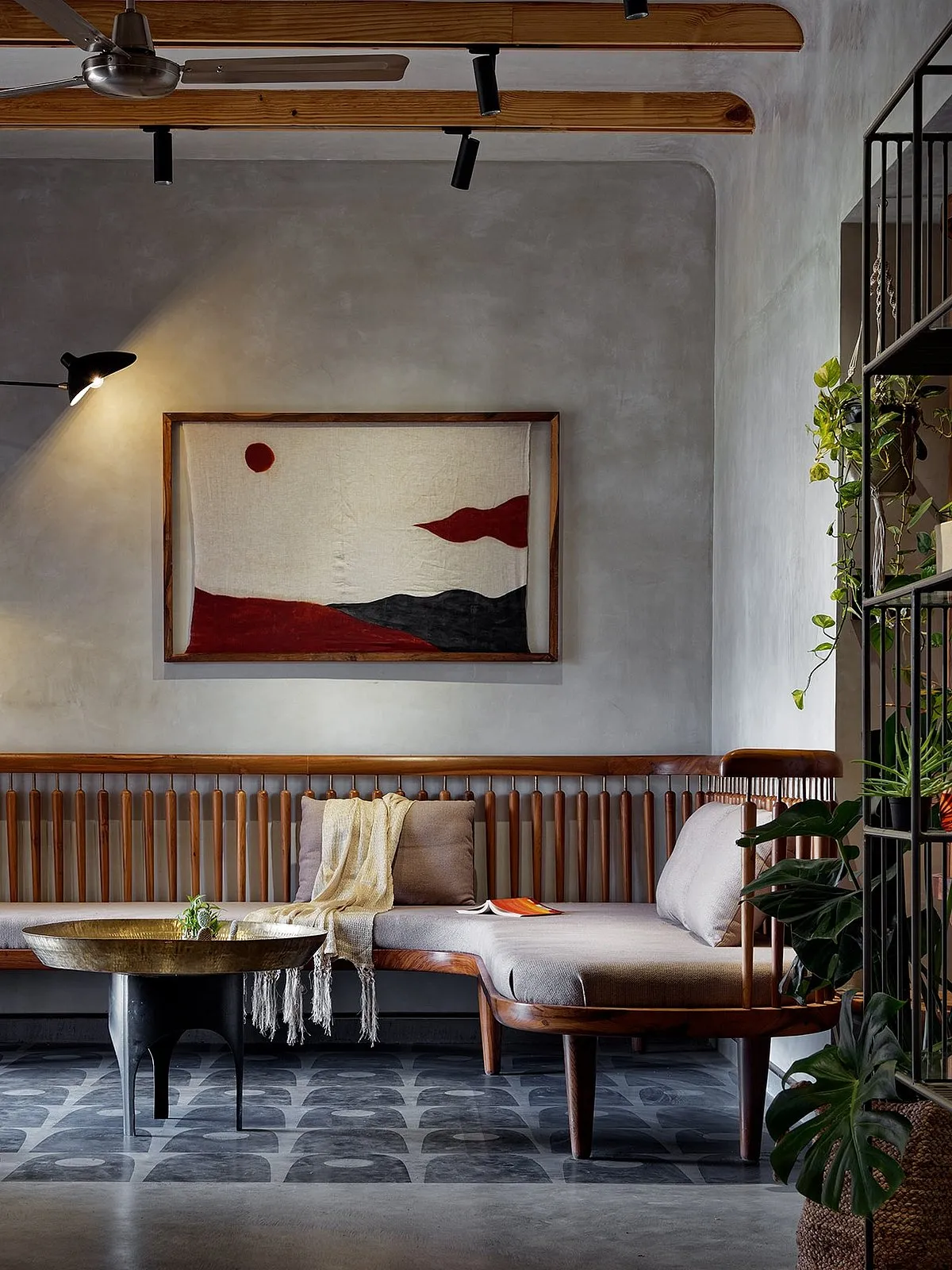 Folk House by Mind Manifestation Design LLPDesigned on the principle of wabi-sabi, the apartment has smooth lime plaster finishes on the walls and ceilings, a concrete floor with beautiful patterns and textures, and teak wood cabinetries. 