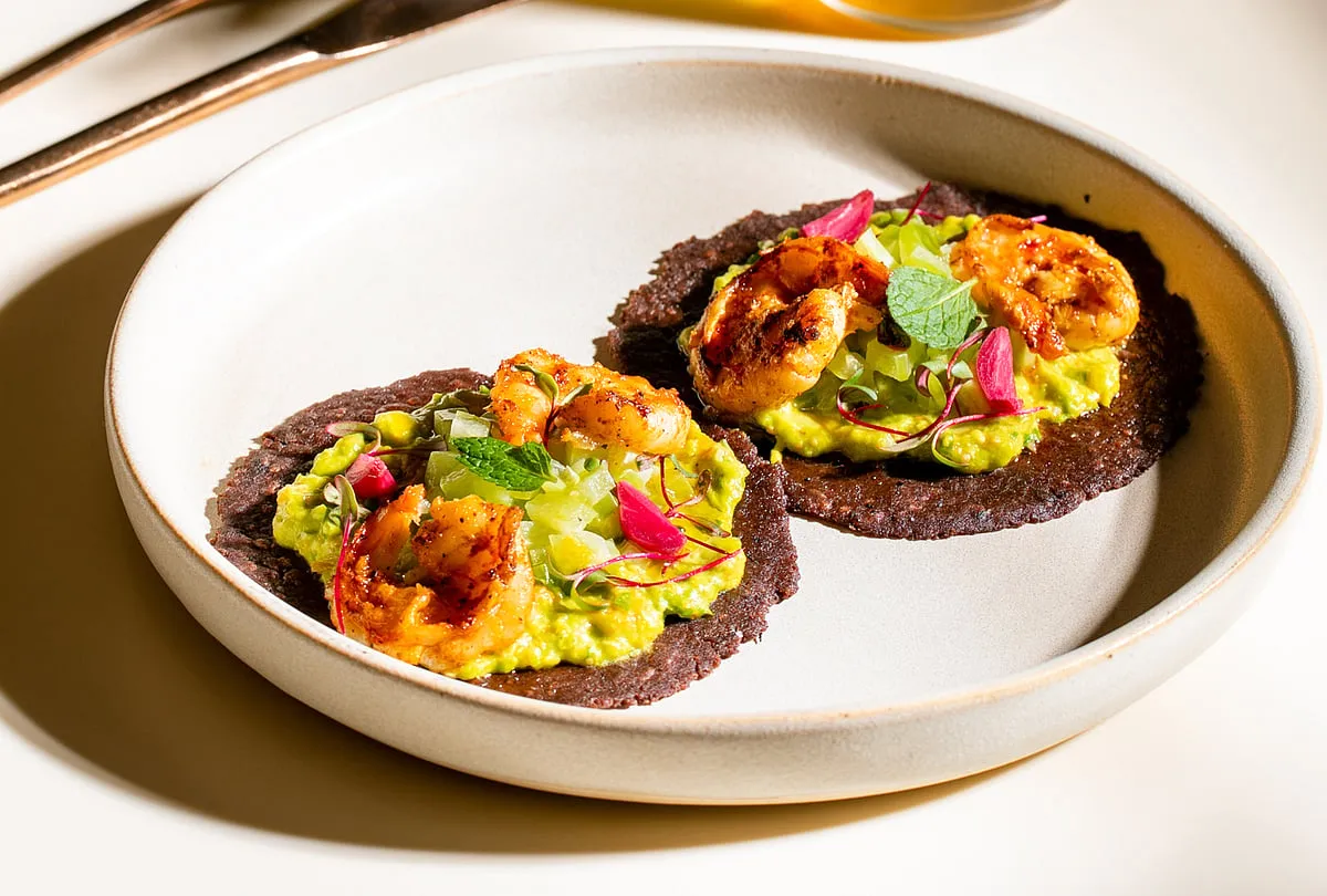 NoonWith a menu highlighting seasonal, organic produce from across India, Noon at Bandra-Kurla Complex encourages its patrons to slow down and savour their food. The monotonal interiors are elegantly done up by Ashiesh Shah. Try experimental small plates like Buckwheat Tartlets, Rainbow Trout and Purple Bean Tacos, and don’t miss their signature cocktails crafted using in-house syrups and bitters.Meal for two costs ₹3,000 approx. Signature cocktails are from ₹700. 