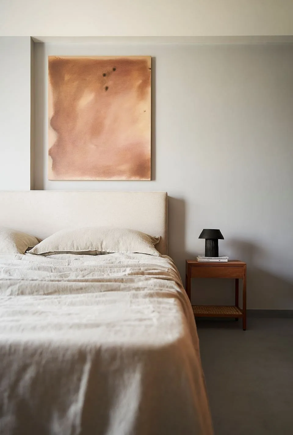 Datum House by SML ArchitectsThe remaining walls of the apartment have been painted a shade of light grey. This was the architect's first step in unifying the home. The second element which links all the spaces is the concrete floor. The other materials—teak and polished plywood furniture and shutter surfaces, bamboo blinds, linen bed sets, brass handles and textured granite tabletops—bring the necessary warmth and tactility. 
