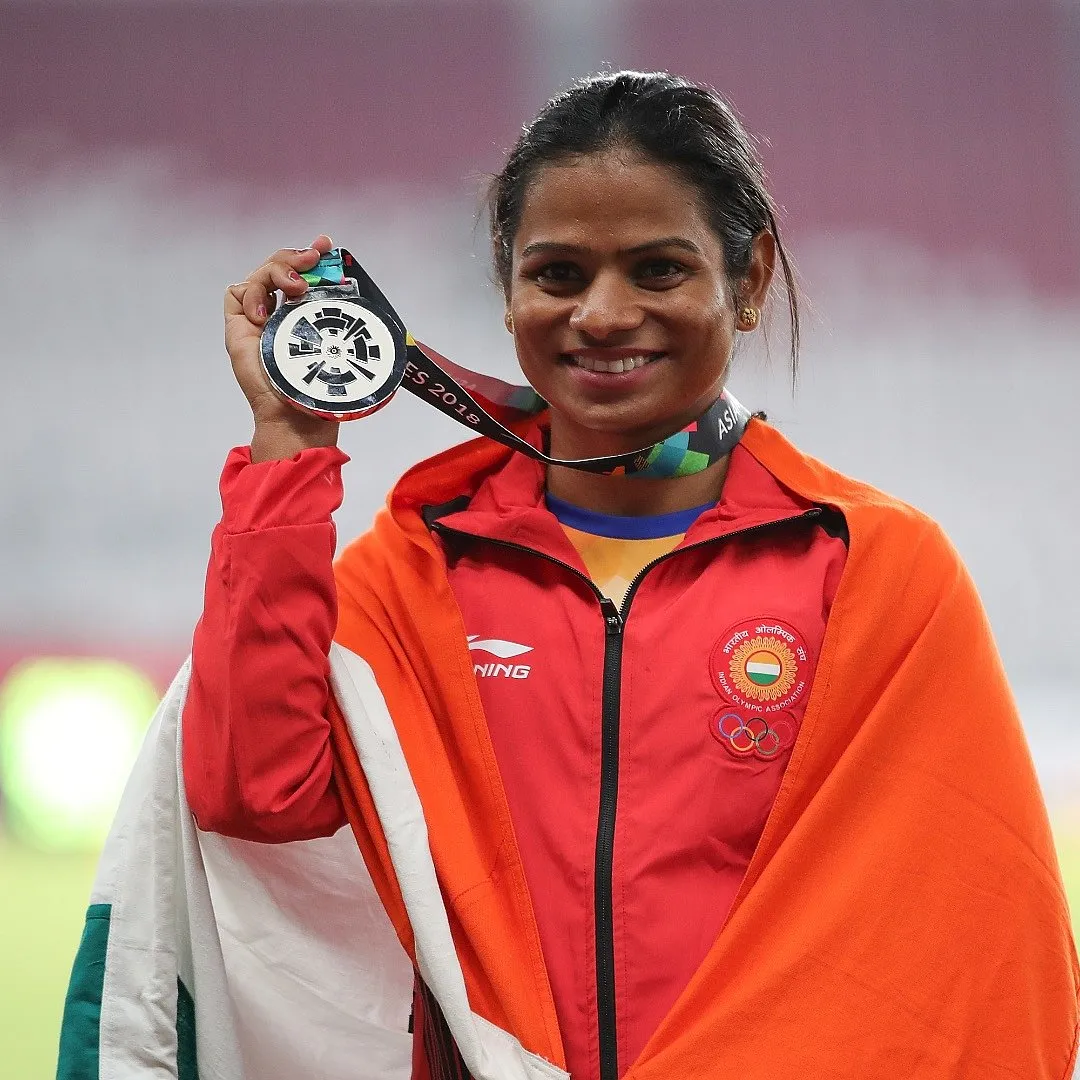 Dutee Chand strikes a pose with her medal. Image: Getty 