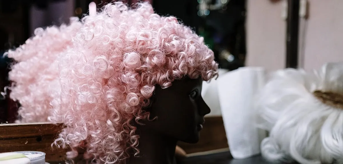 You won’t  find people shopping for wigs and extensions openly at the mall, considering the fact that they come with the kind of taboo people equate to plastic surgery. Image: Pexels 