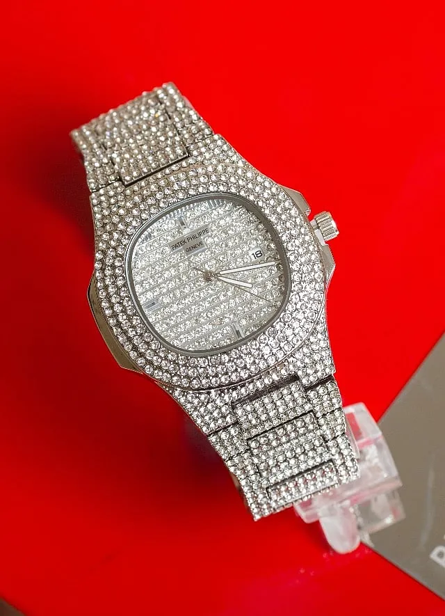 The Patek Philippe Nautilus is fully set with 255 diamonds and three baguette diamond hour markers with a 18K gold dial plate, Image: Pexels 