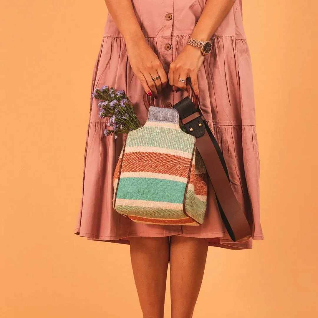 Swarang DesignsWhat first strikes you when you browse through New Delhi-based brand Swarang’s many offerings is the diversity. It’s almost hard to put your finger on a common thread but on closer inspection you do discover one. What binds the designs that are as varied as leather clutches and multi-hued cloth crossbody bags is a goal to shed light on not one but several of the country’s crafts. Each item on their website is accompanied by a strong backstory that shares the age-old technique at its core as well as the names and roles of the artisans who created it. Swarangdesigns.com 