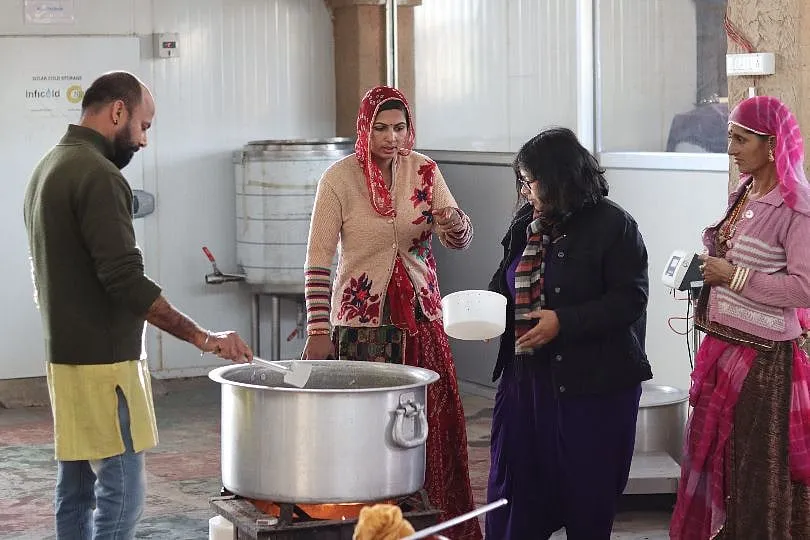 Namrata Sundaresan, one of the founders of Käse Cheese guiding the Maldhari community on cheese-making  
