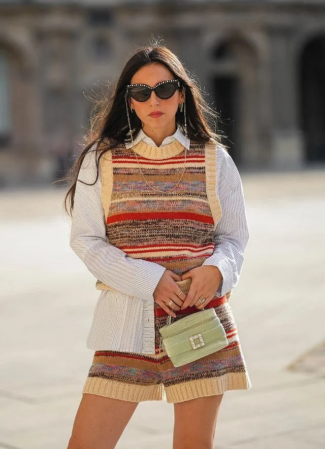 As far as knits go, a lightweight cardigan or a vest is a perfect layering item to have in your closet. Image: Getty 