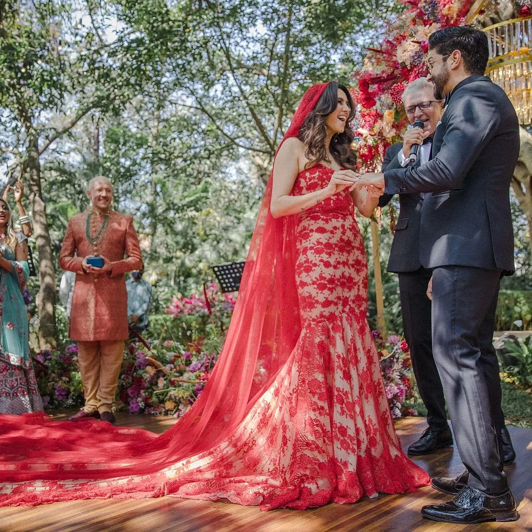 While the silhouette of Shibani Dandekar's wedding dress was modern, the choice of colour, inspired by “Valentino red”, lent a hint of tradition 