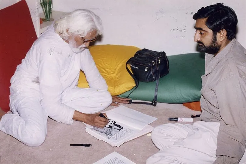 Husain could paint anywhere, photographed here with the author art gallerist Anil Relia  