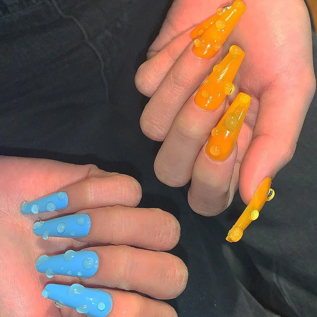 Sojin Oh (@sojinails)Love those water drop nails that all the cool kids were wearing? Sojin Oh created those 3D wet–look nails for Kim Kardashian’s Skims Campaign—a nail look that so many people are urging their nail techs to imitate. She pushes the boundaries when it comes to nail art, adding sculptural shapes and structures onto the nail bed to create wearable art. 