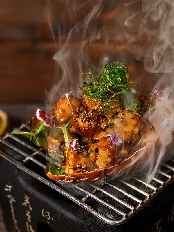 The robata grill orders that are served on mini charcoal grills 