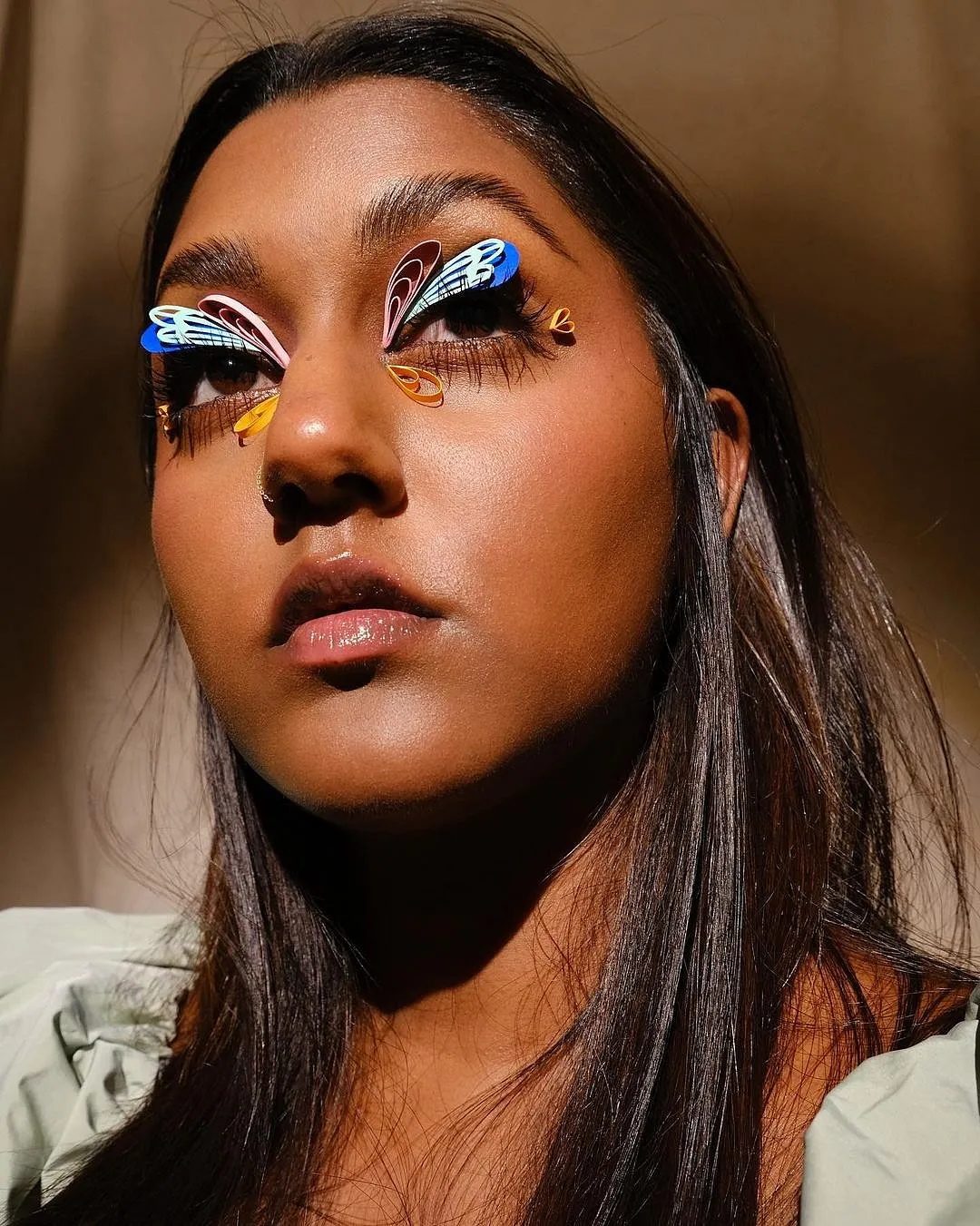 Lavanya WilesLavanya Wiles has put everything possible onto her eyelids: twisted-up papers, gold leaf, strings, baubles and real flowers are just some of the mediums she’s experimented with. The make-up artist and art director is definitely influenced by her background in design and craft, so her use of unconventional materials keeps you guessing every time a photo comes up on your feed. 