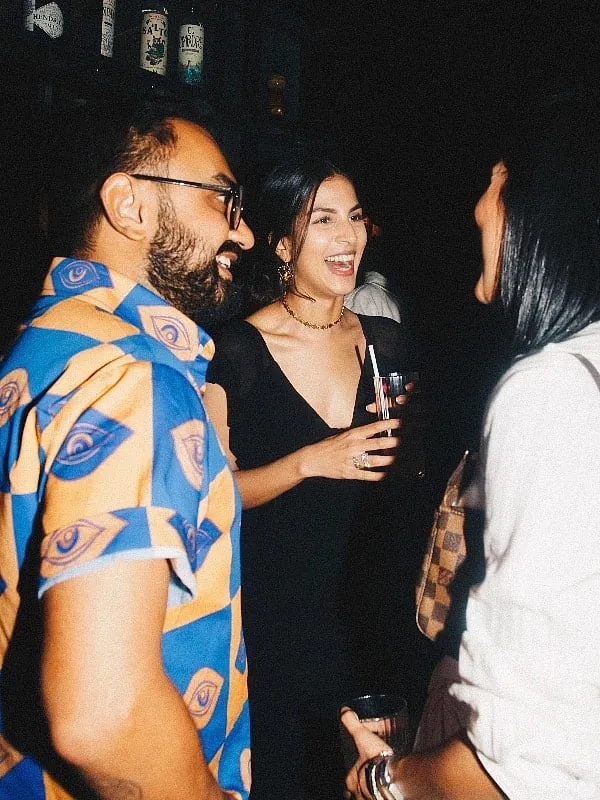 Saffaronart PR representative Rhea Kuruvilla chats with stylist  Akshay Tyagi Image: Eeshani Mitra 