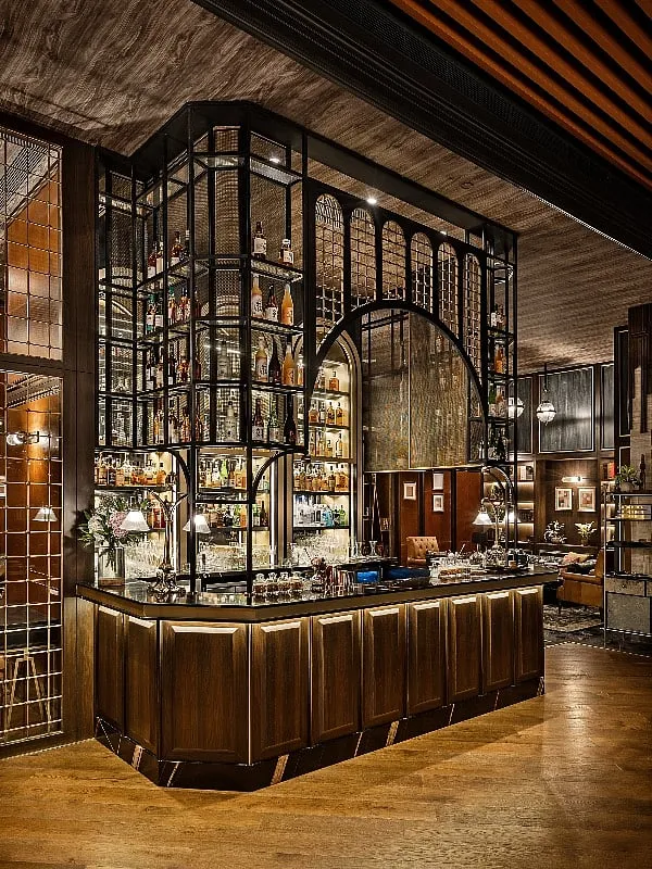 The well-lit bar at Koishii serves as an anchor around which a weekend crowd builds 