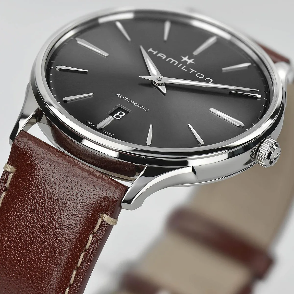 Hamilton Jazzmaster Thinline Auto:This brand is a personal favourite because it produces fabulous watches at prices that are very reasonable in the luxury scheme of things. Ultra-thin watches that are priced under $1,000 are normally hand-wound in order to keep the thickness of the case down, but the Jazzmaster (what a great name!), in this price bracket has an automatic winding movement and still manages to pull off a thickness of just 8.5mm. It is available in a variety of dial colours, with each finished in a sun-ray effect. The case has OG sculpted lugs on it, to round off the design. 