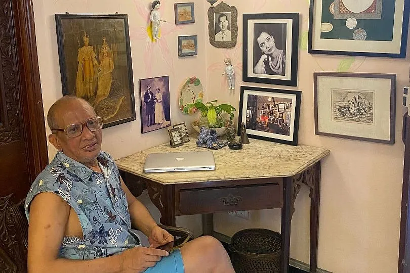 At work, surrounded by antiques collected over the years and memories: in the centre is Thelma and to her left is Owen--Ferreira's parents  