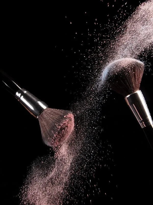 Too much powder, when it emulsifies and mixes with water and oil, can become a chalky mess on the skin. Instead, just use enough to blot and then brush off the excess. Photo: Pexels 